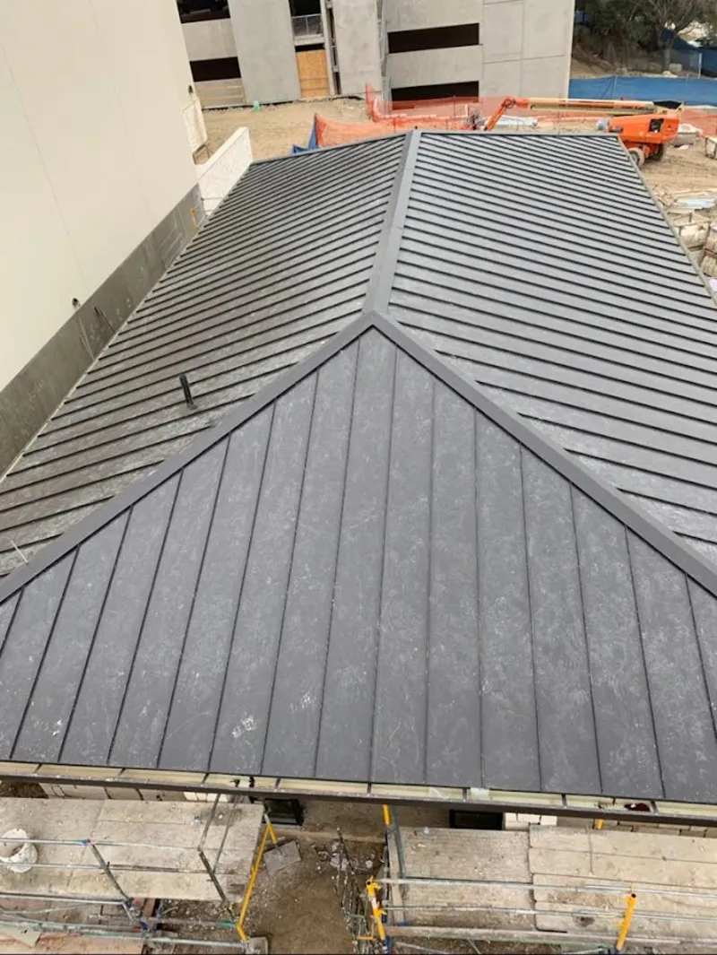 Commercial metal roof construction with crane equipment in Huntingdon